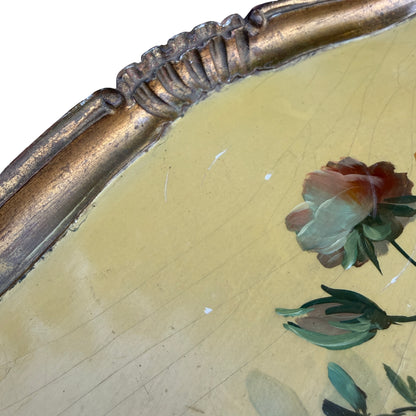 High angle view of hand-painted floral centre and gilt border on tray