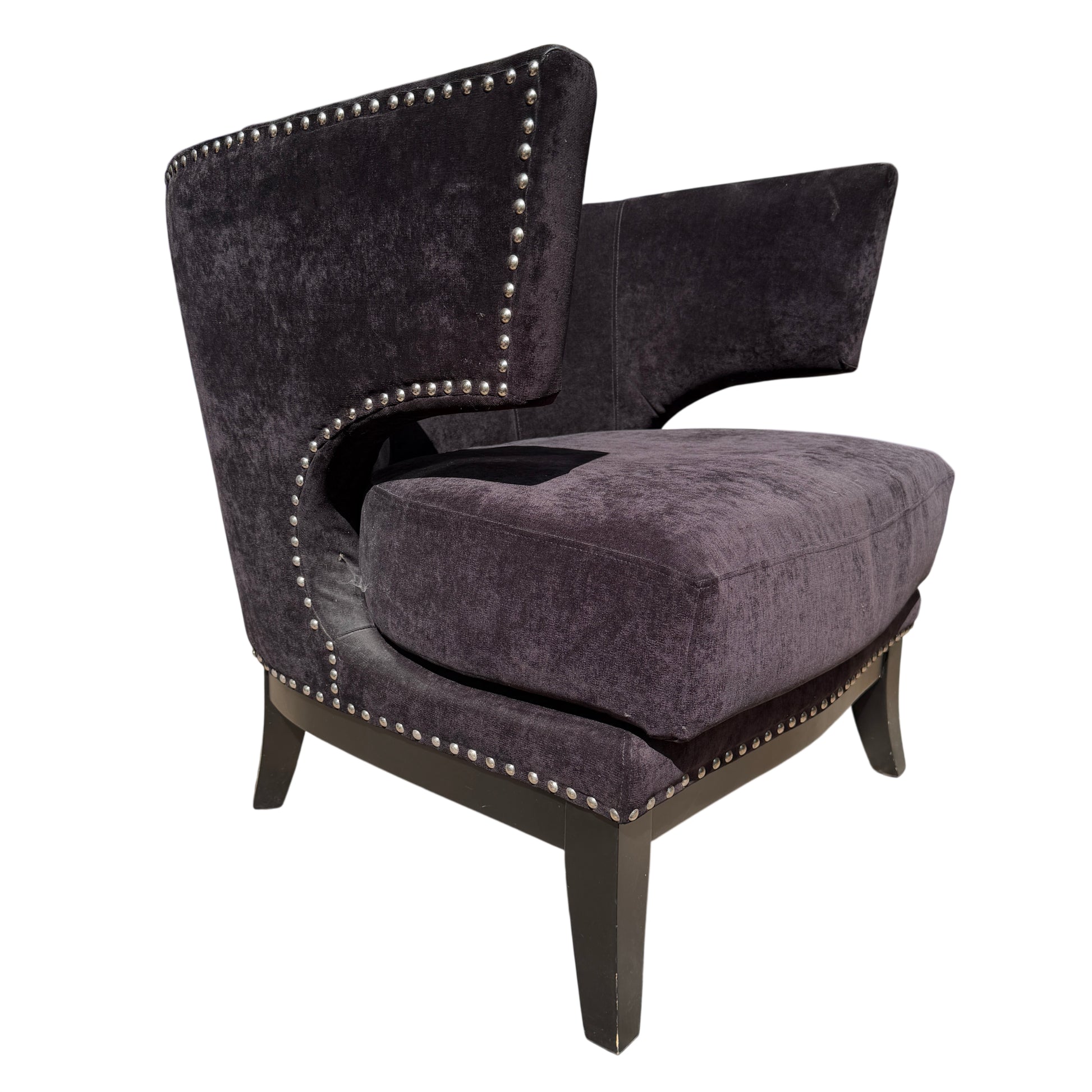 Side view black wingback chair with nickel stud trim and dark velvet-effect fabric
