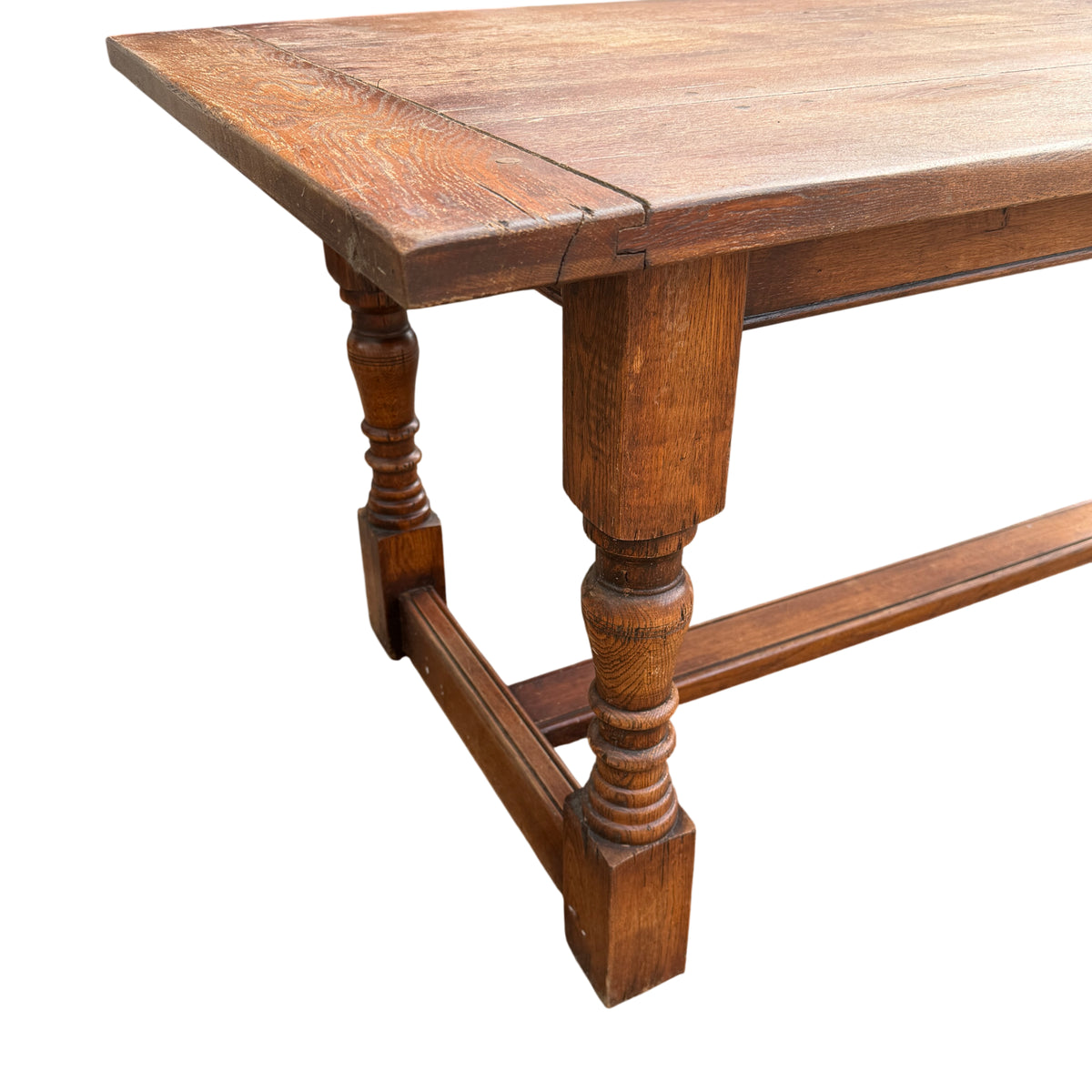 Large 200cm oak dining table in country Jacobean style shown outdoors