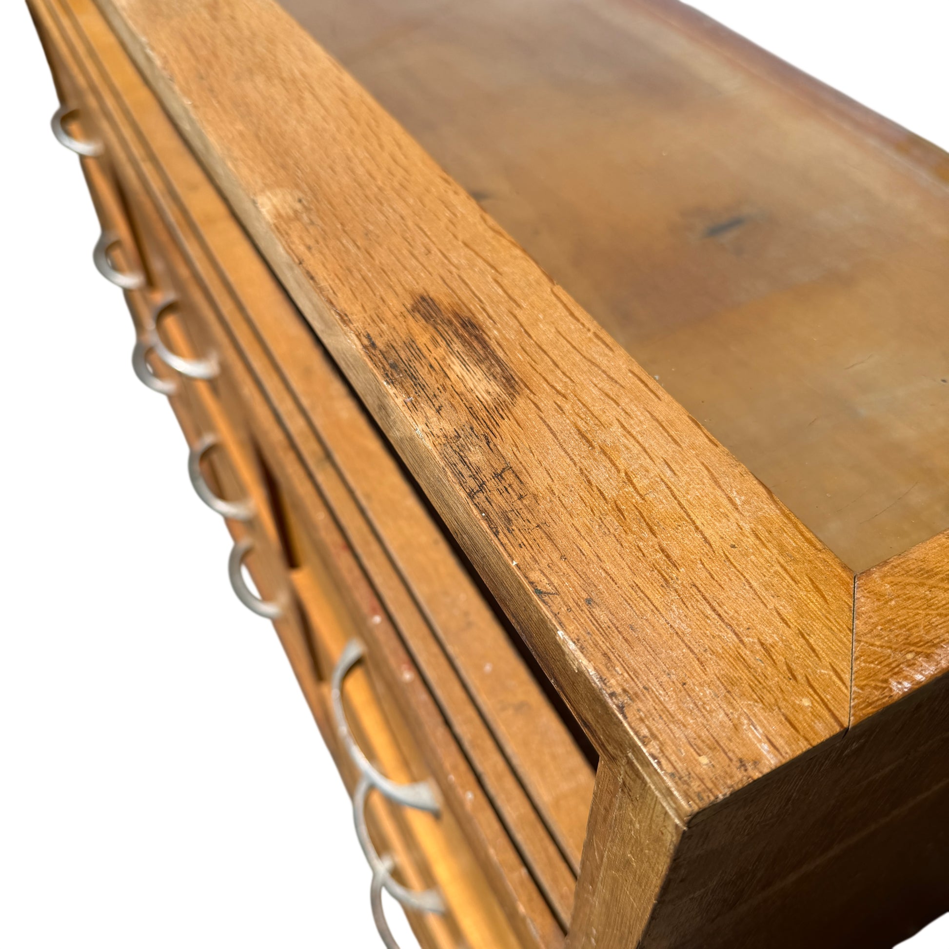Angle view of retro shop counter on tapered legs with paint loss on feet