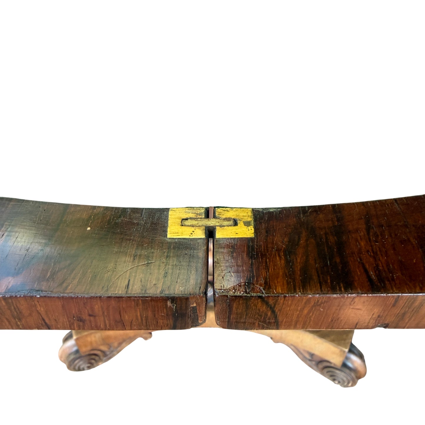 Side view of rosewood tilt-top card table with carved apron detail