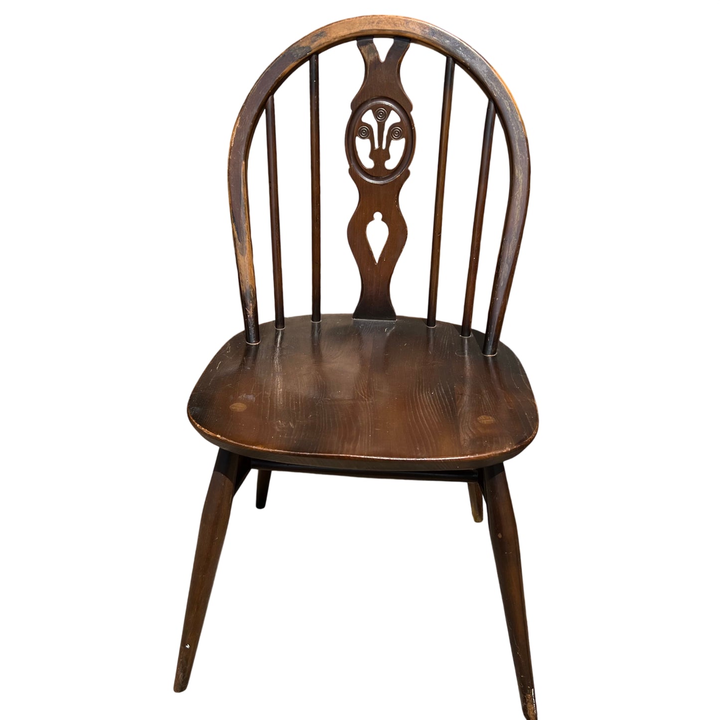 Windsor-style dining chair with carved oval back motif and slim turned spindles