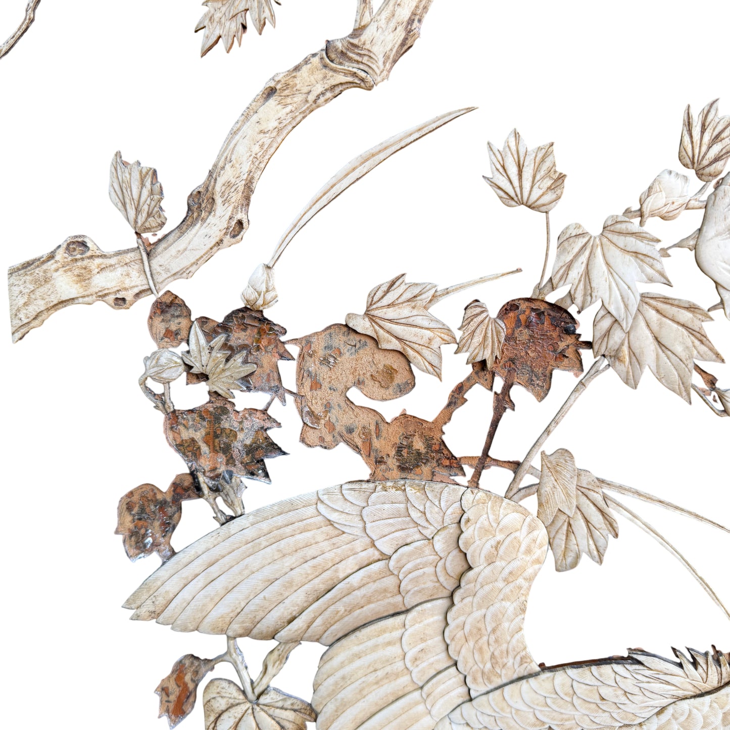 Close detail of carved floral inlay pieces on a vintage Chinese-style folding screen