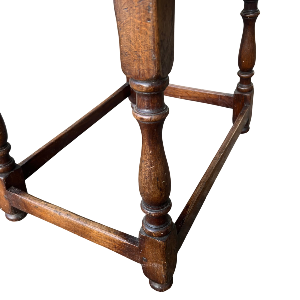 Low oak side table with turned legs and cross stretcher base