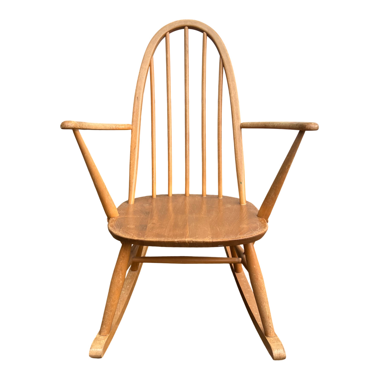 Vintage spindle-back rocker showing arched top and turned spindles from front
