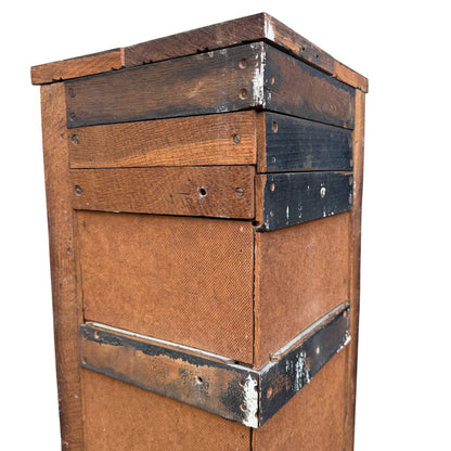Side view showing latch and peg detail on oak corner wall cabinet