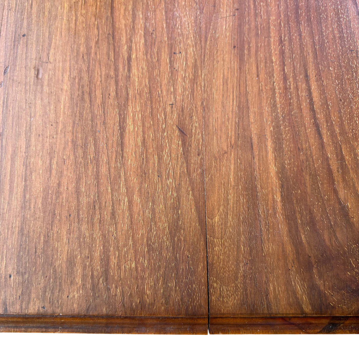 Edge detail of oak tilt-top table showing wear and scratches