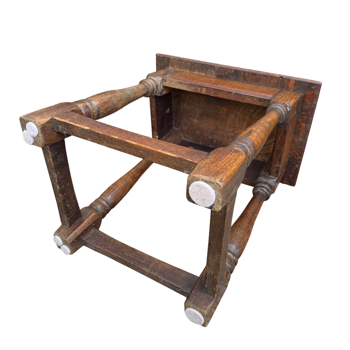Corner detail of oak side table showing pegged construction and worn edge