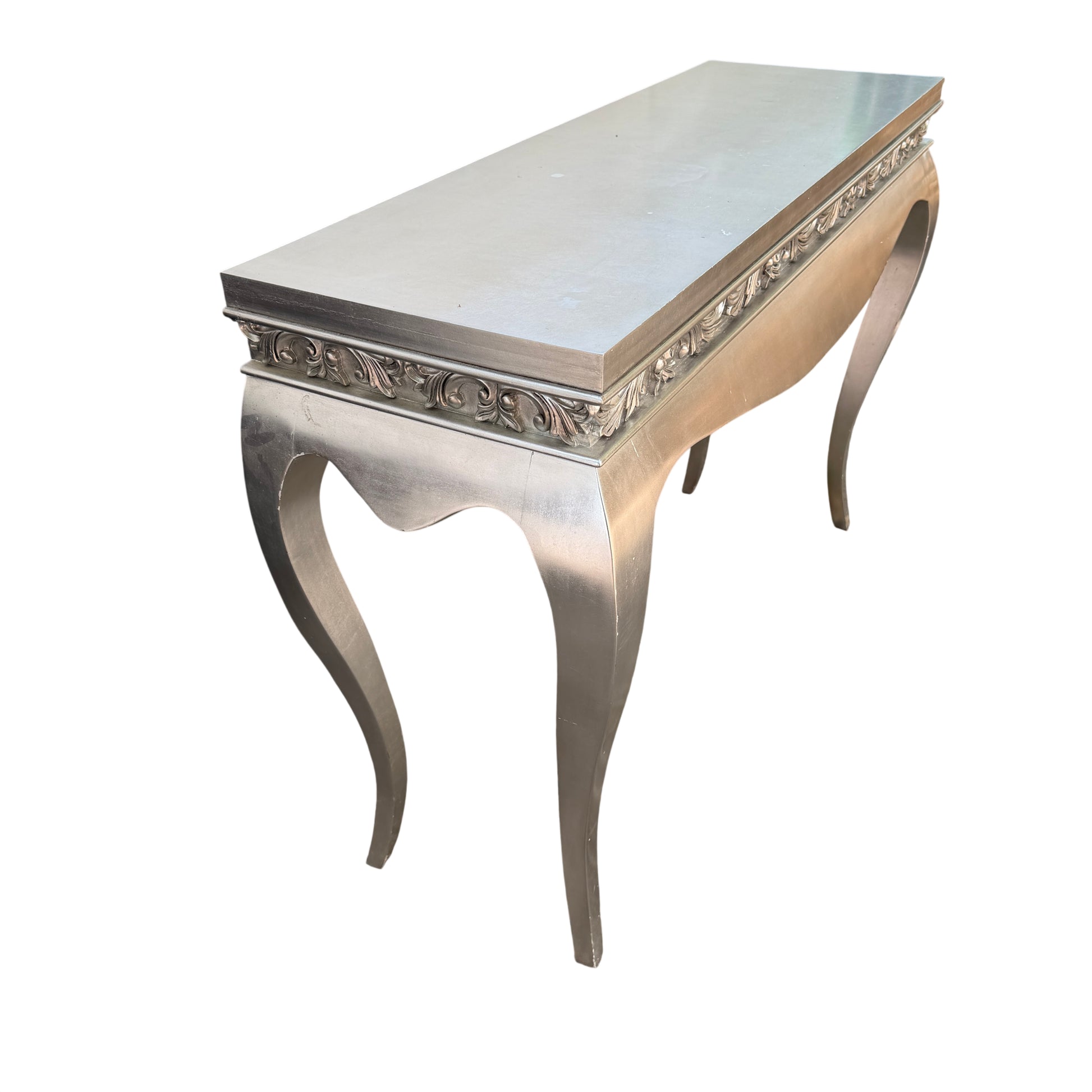 Detail of scratches and surface marks on the top of a silver painted console table