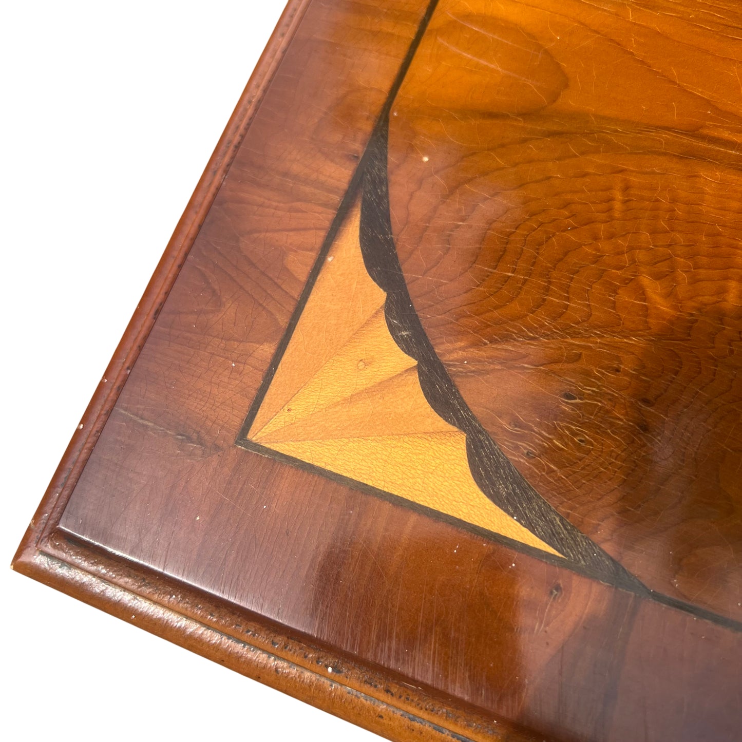 Top edge detail showing mahogany veneer and inlaid corner decoration