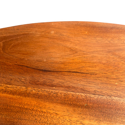 Close-up of wooden table top with light scratches and finish wear