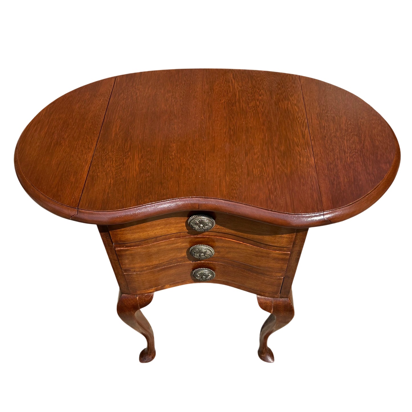 Detail of cabriole leg and shaped foot on small bedside chest
