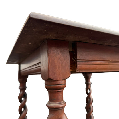 Detail of open barley-twist turned legs on a vintage occasional table