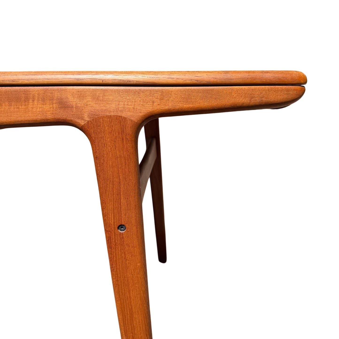 Close-up of teak tabletop edge and corner profile on mid century dining table