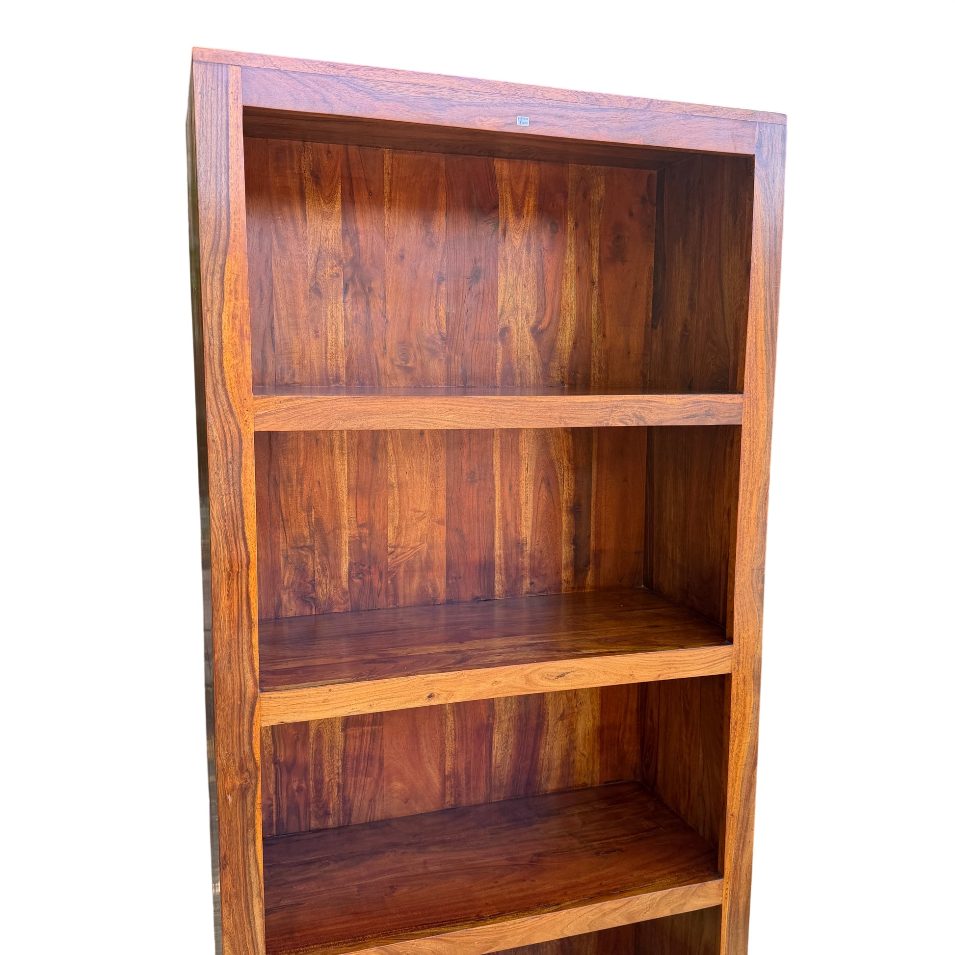 Tall solid wood bookcase with open shelving and visible grain