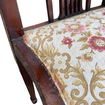 Front view showing tapered legs and shaped seat frame on corner chair