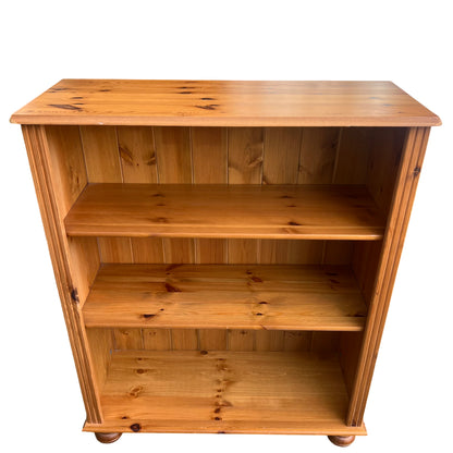 Front view of open pine bookcase with two internal shelves and base shelf