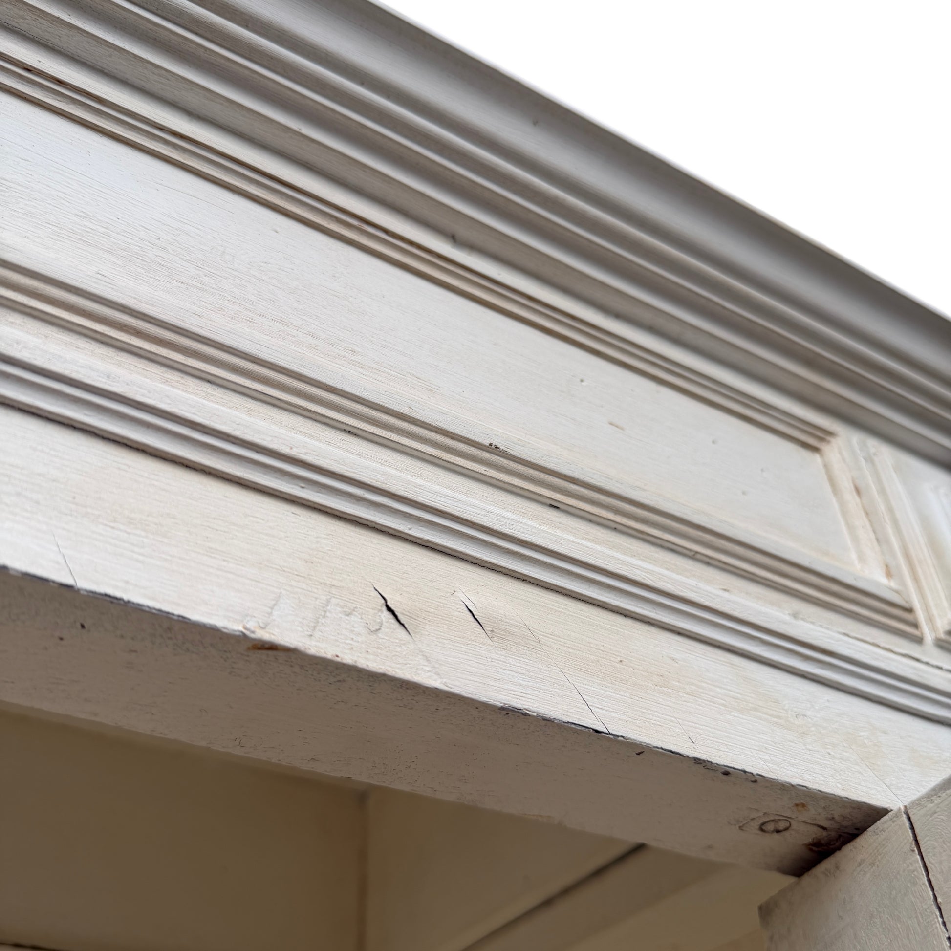 Close-up of tassel on the cabinet keyhole and painted surface texture