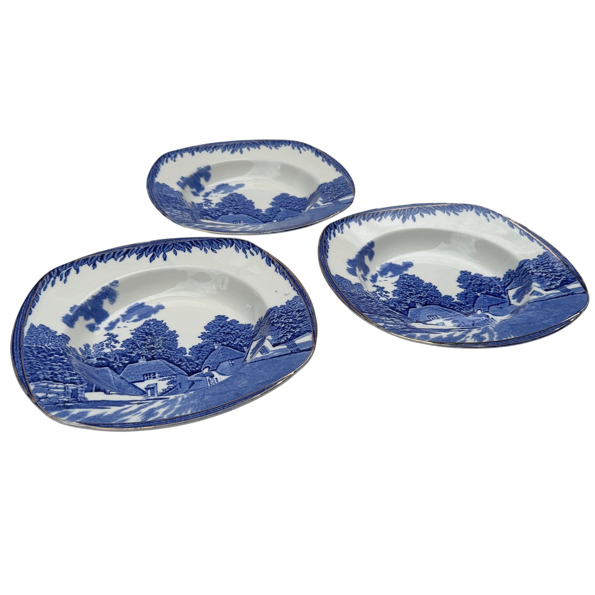 Single Burleigh Ware blue and white soup bowl showing village transfer scene and gilt edge