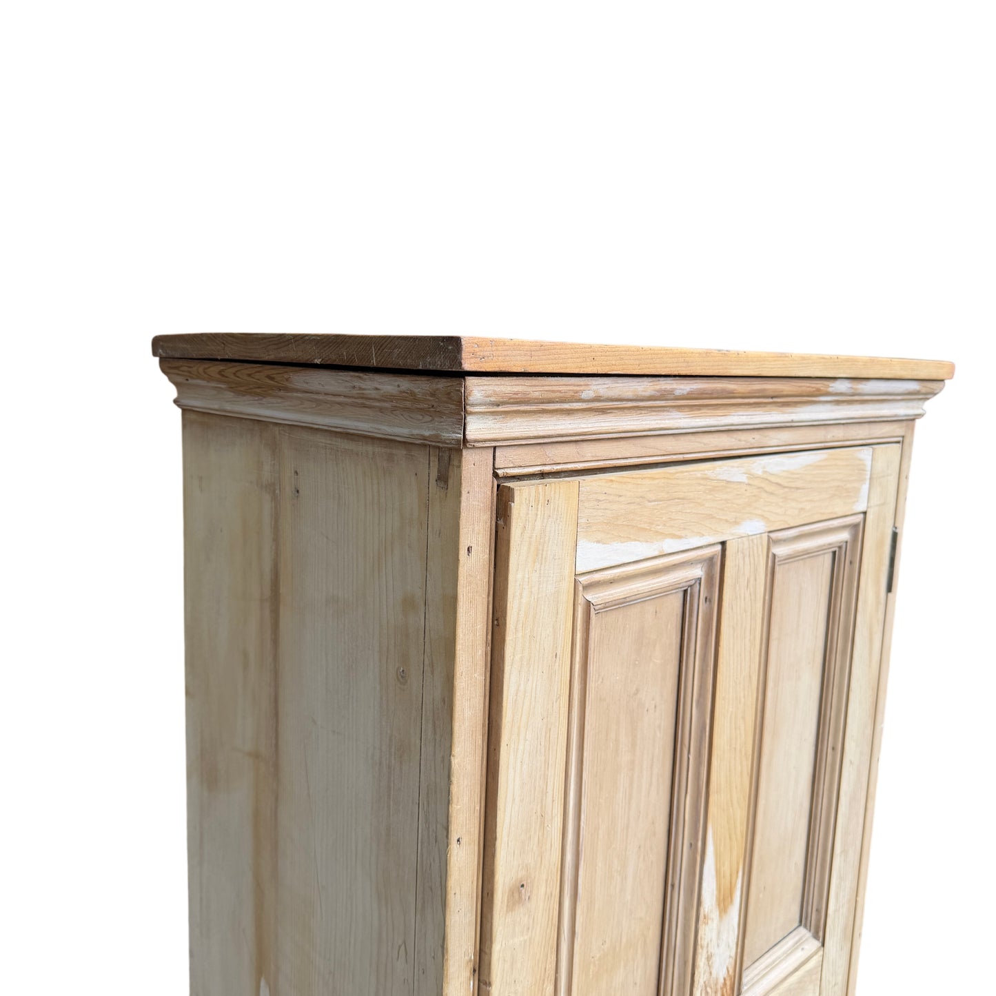 Close-up of moulded top cornice and stripped pine surface