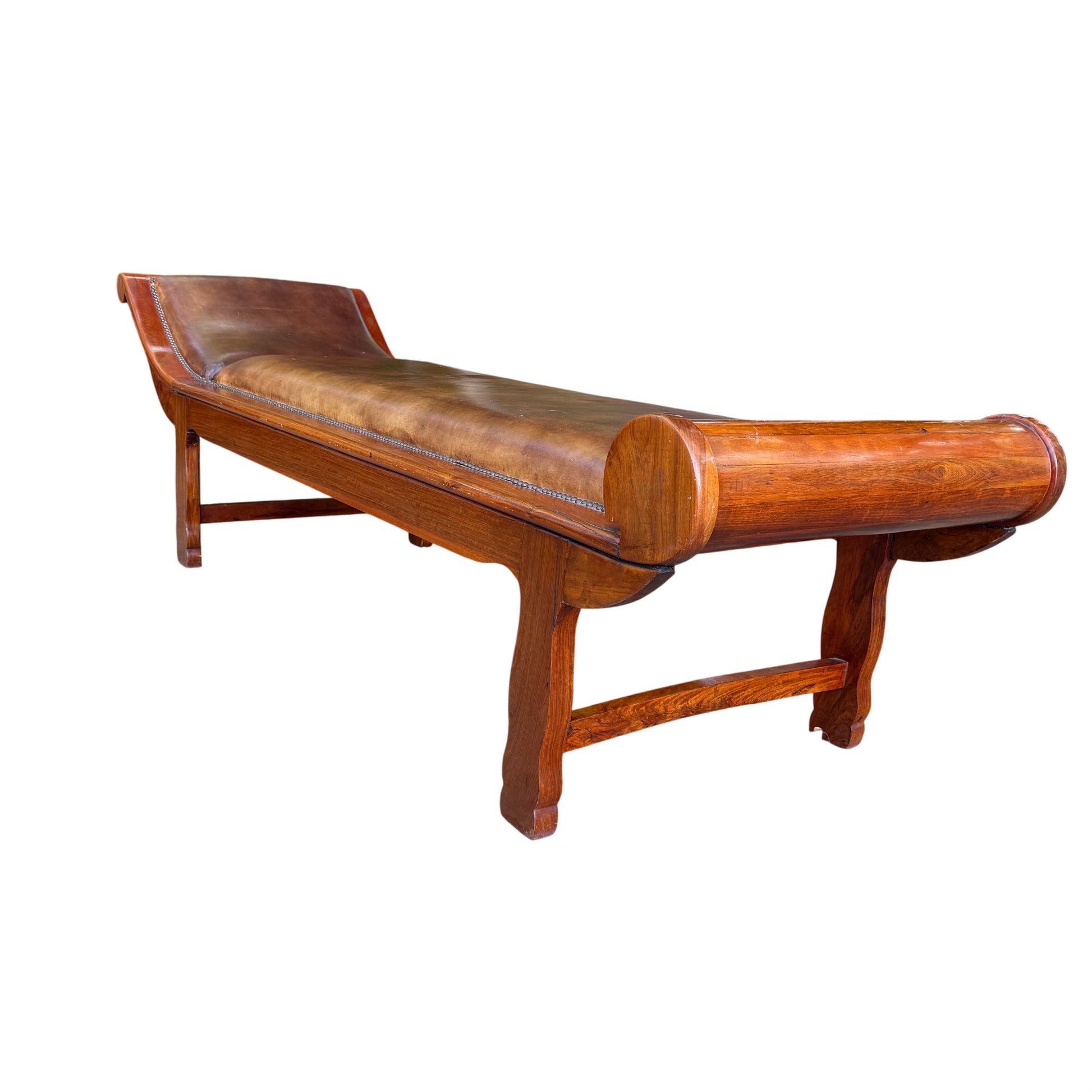 Brown leather chaise longue on a solid wood frame showing stitch repair and surface wear
