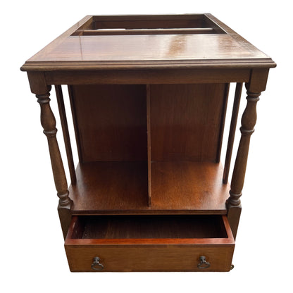 Front view of wooden Canterbury with drawer and pair of antique style handles