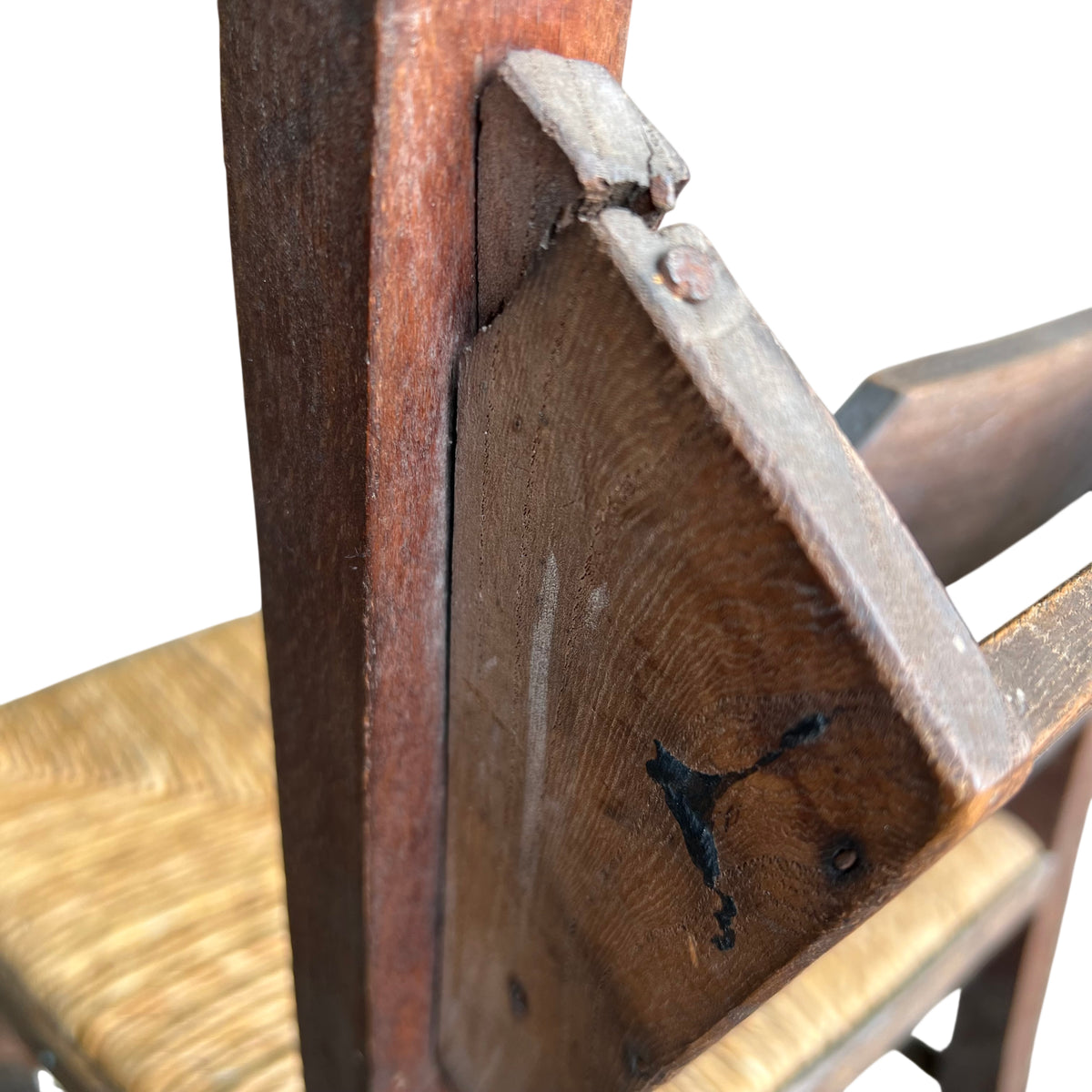 Lower view showing stretchers and scuffed legs on rustic dining chair