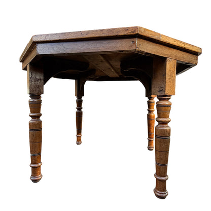 Corner close-up showing crack and glued repair on oak table edge