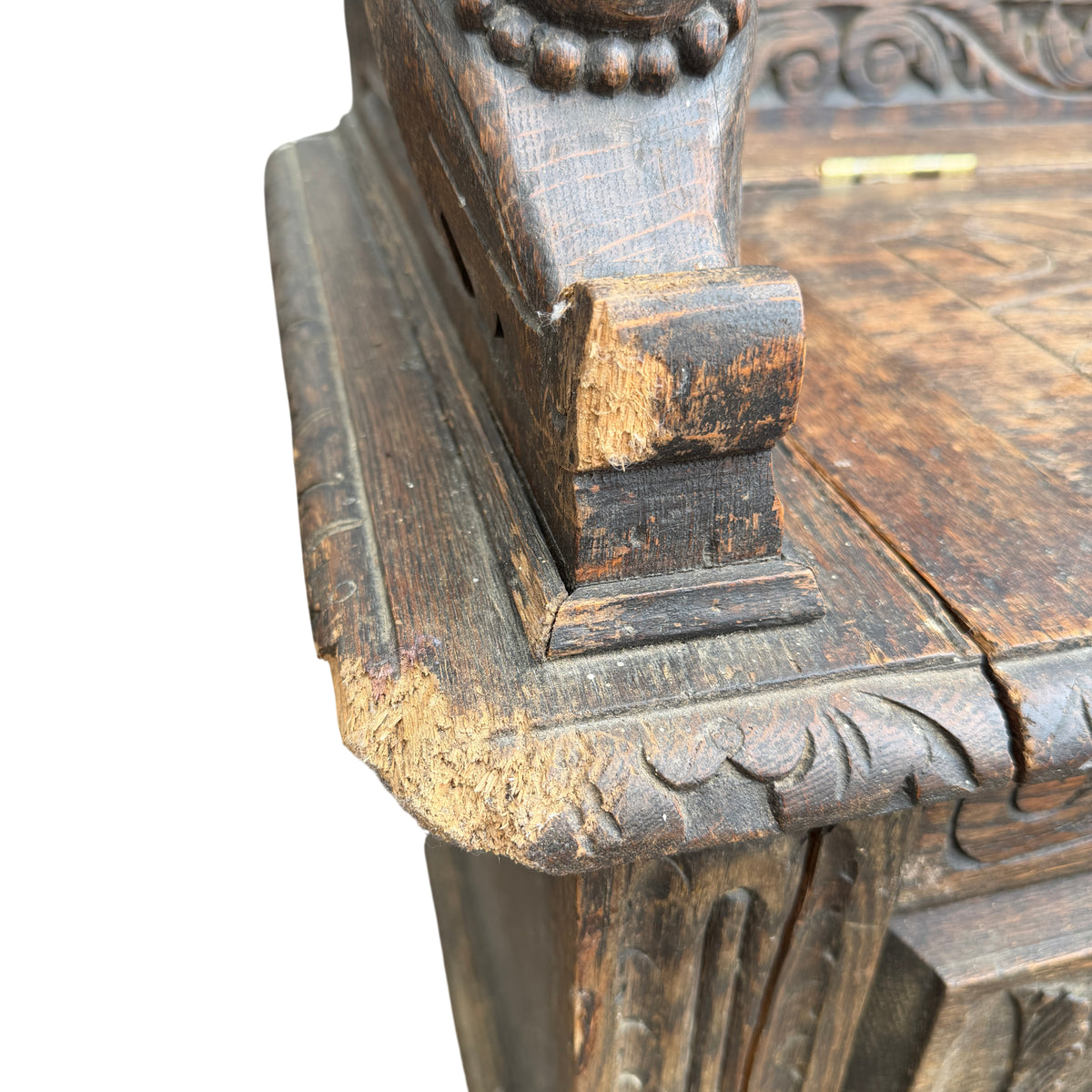 Carved oak hall bench with foliate scrollwork and mythical beast uprights
