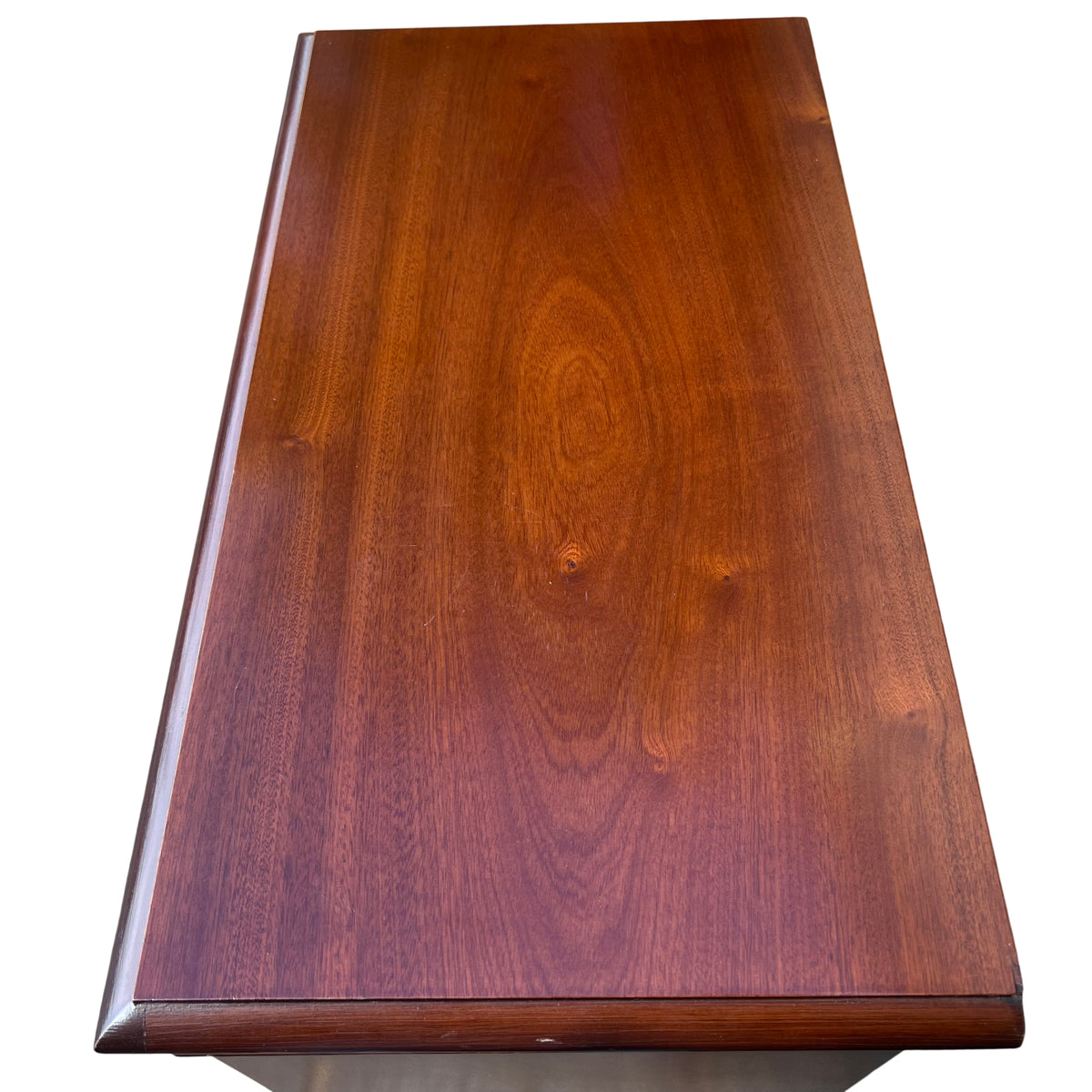 Side view of compact mahogany bookcase showing veneered finish