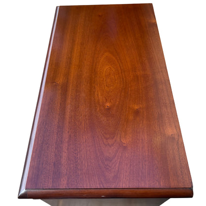 Side view of compact mahogany bookcase showing veneered finish