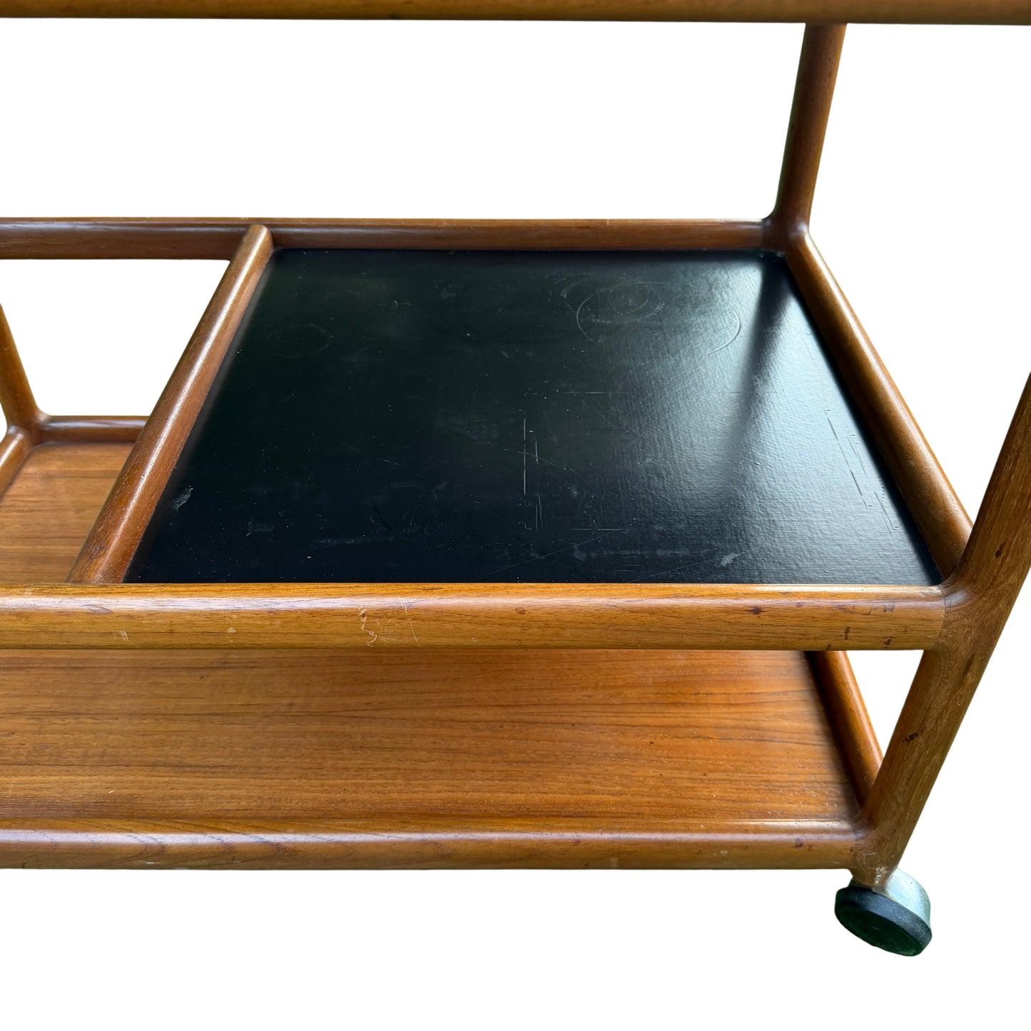Side view of Danish teak trolley with rounded vertical supports