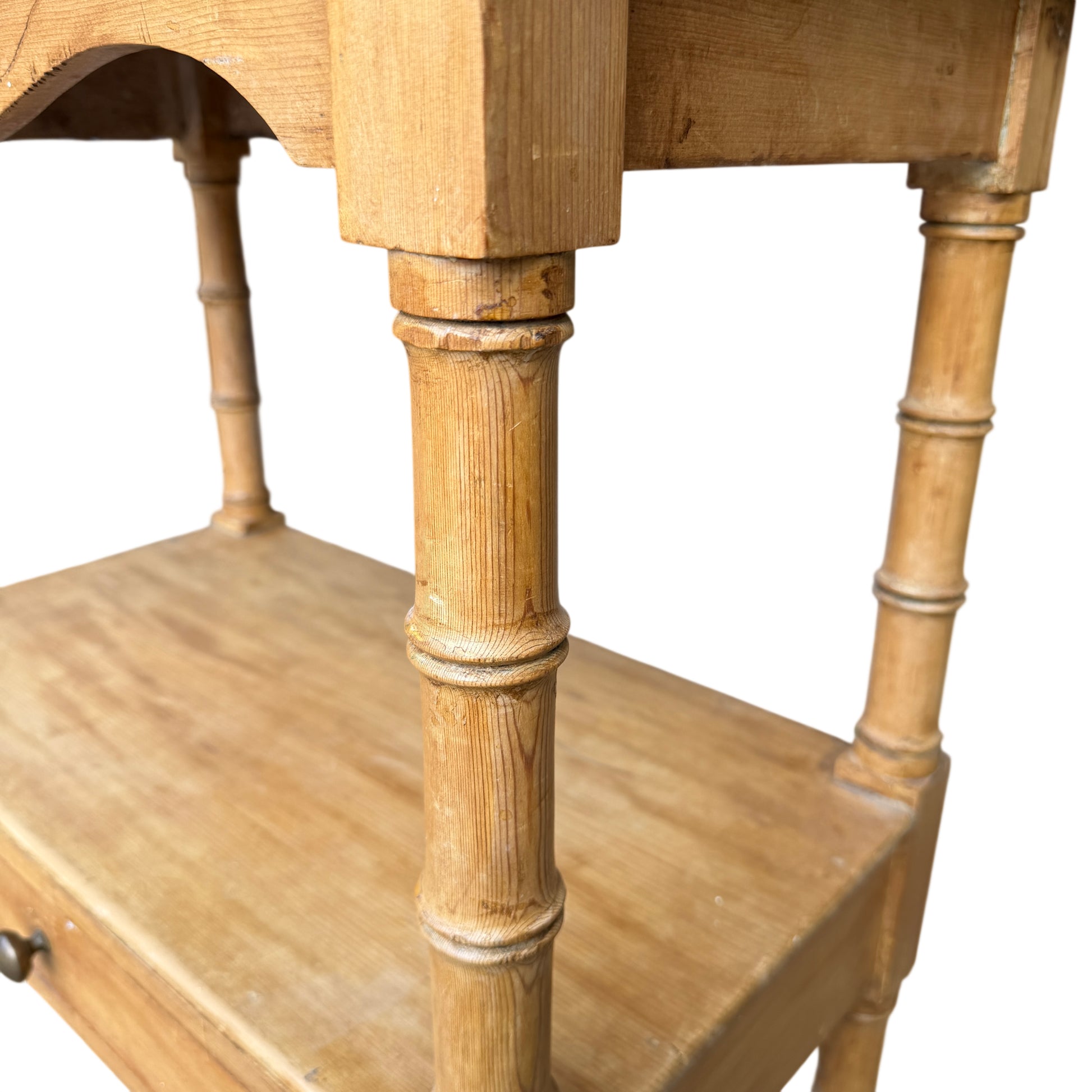 Side profile of Victorian pine bedside cabinet with scrolled gallery sides