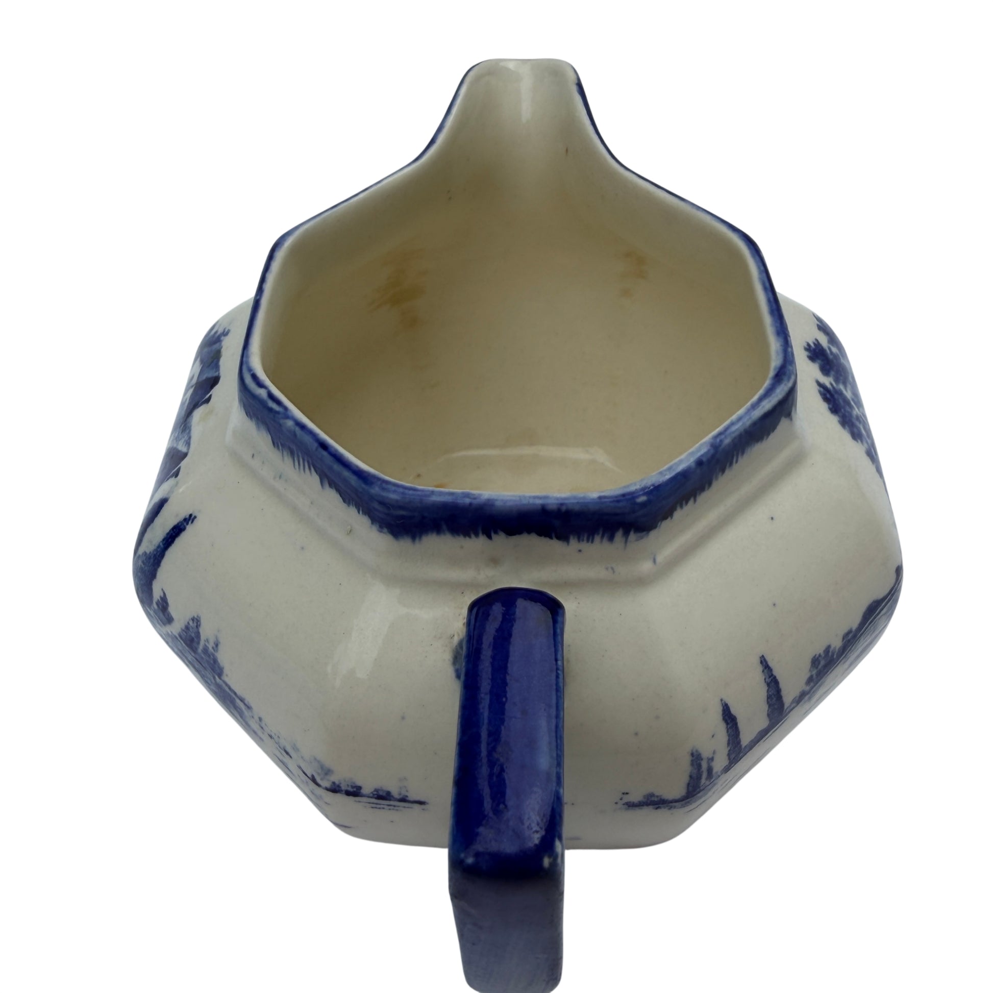 Interior of Royal Doulton milk jug with light staining and glaze crazing visible