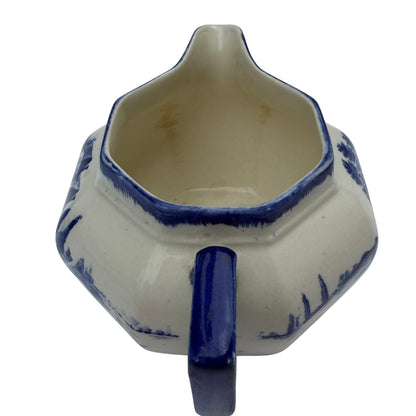 Interior of Royal Doulton milk jug with light staining and glaze crazing visible