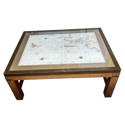 Side view of oak coffee table with brass trim and solid straight legs