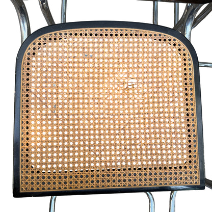 Close-up of woven cane seat showing pattern and natural discolouration on a Mid Century chair