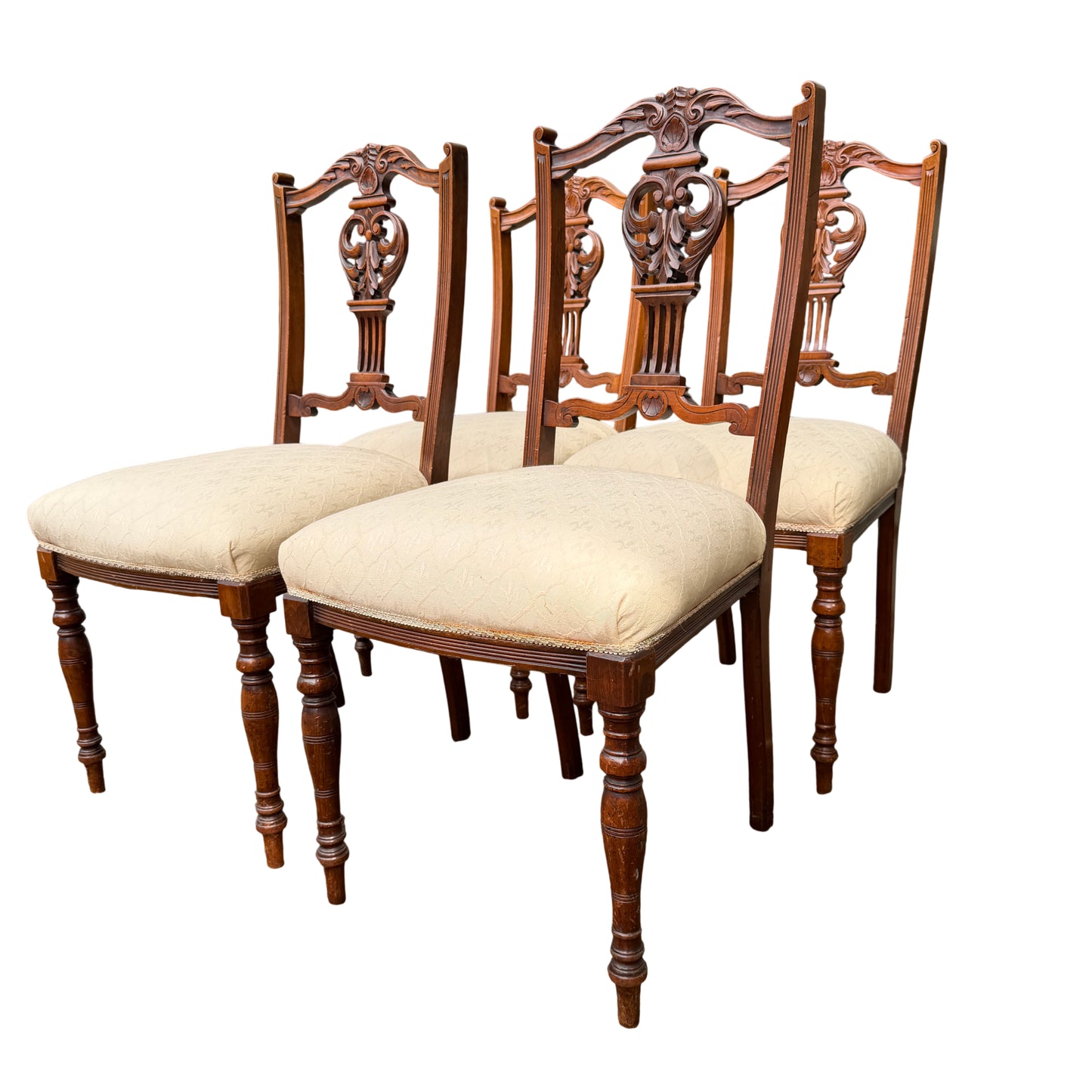 Close-up of carved crest and pierced back splat on an Edwardian dining chair