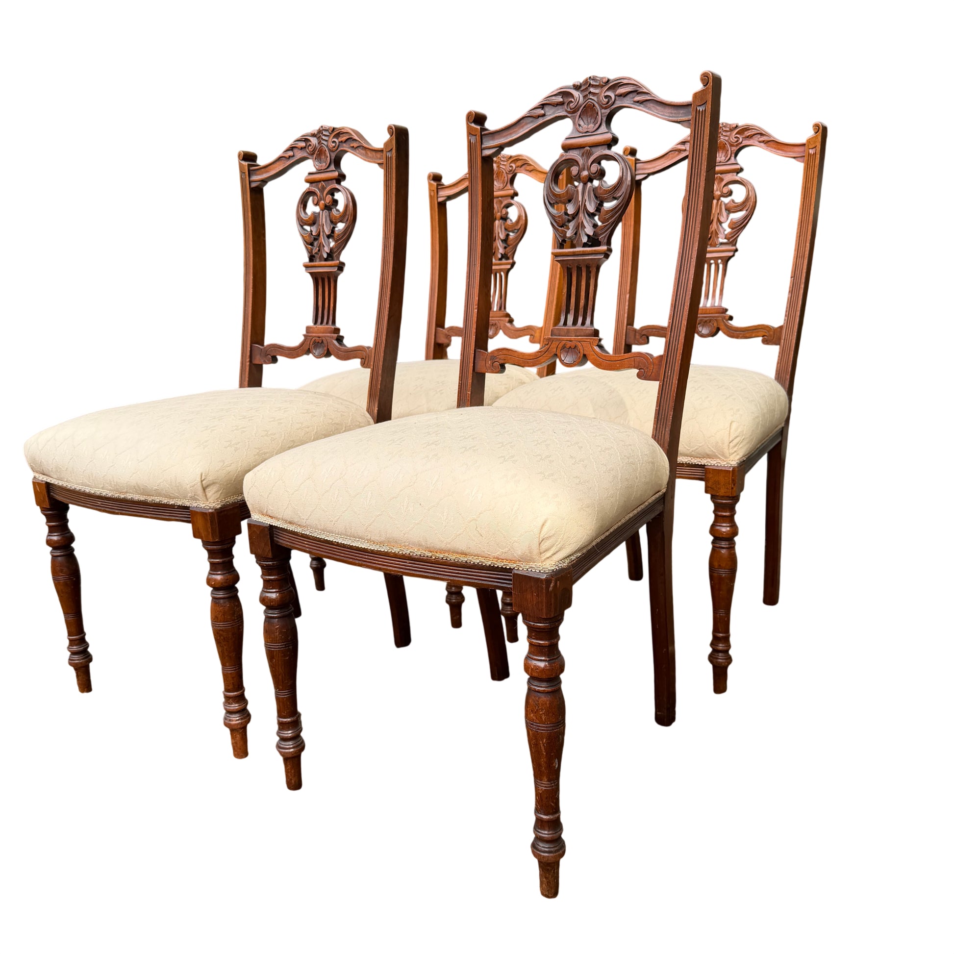 Close-up of carved crest and pierced back splat on an Edwardian dining chair