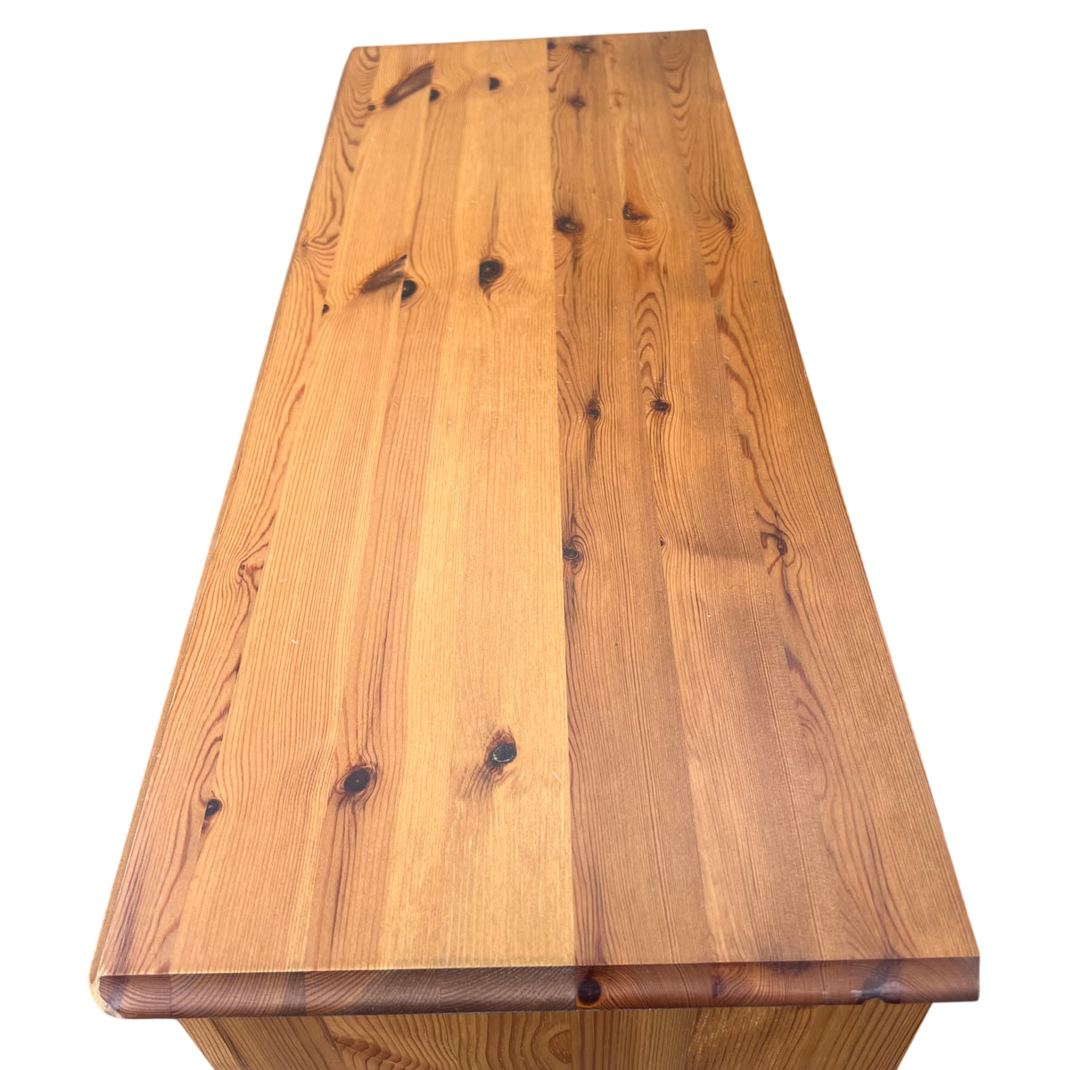 Vintage wooden bookcase showing top shelf and panelled interior