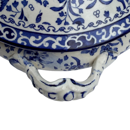 Partial side view showing one ornate handle of the Burleigh covered tureen