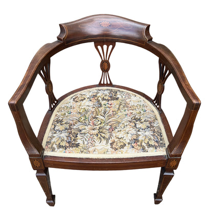 Edwardian inlaid mahogany tub armchair with floral tapestry seat and curved back