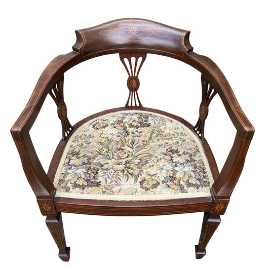 Edwardian inlaid mahogany tub armchair with floral tapestry seat and curved back