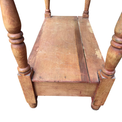 Lower shelf and storage box area of pine hall table with scuffs