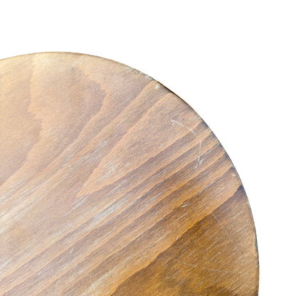 Low angle view of round stool and turned leg detail in natural wood