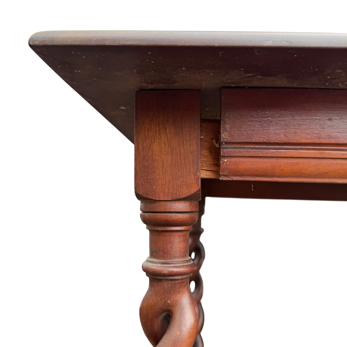Close-up of moulded rectangular top and apron of a vintage hall table