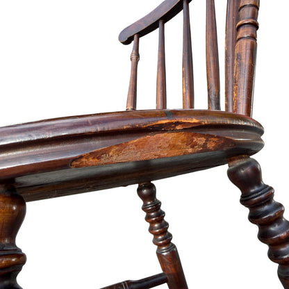 Close-up of penny seat showing surface scratches and patchy finish on wooden seat