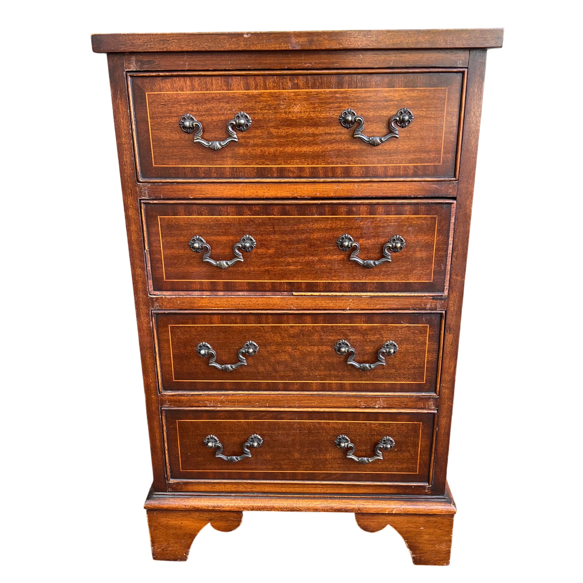 Narrow vintage mahogany veneer chest of drawers front view with brass drop handles and inlaid stringing