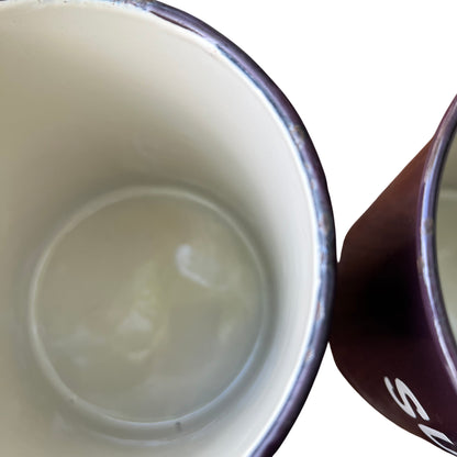 Detail of white lettering on purple enamel canister reading SULTANAS