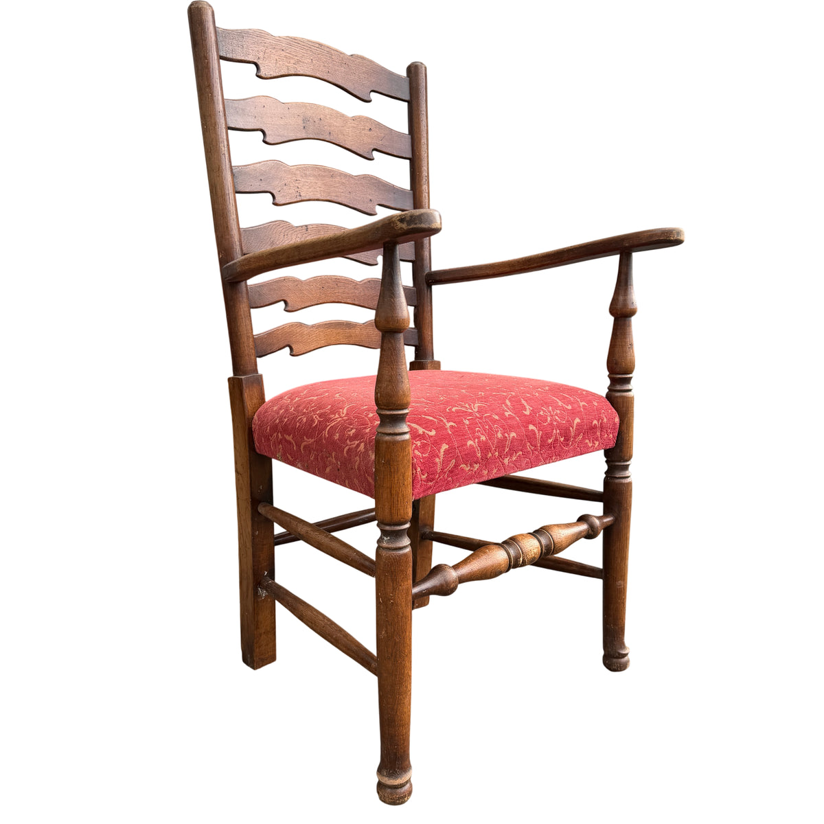 Arrangement of wooden ladderback dining chairs showing turned legs and stretchers